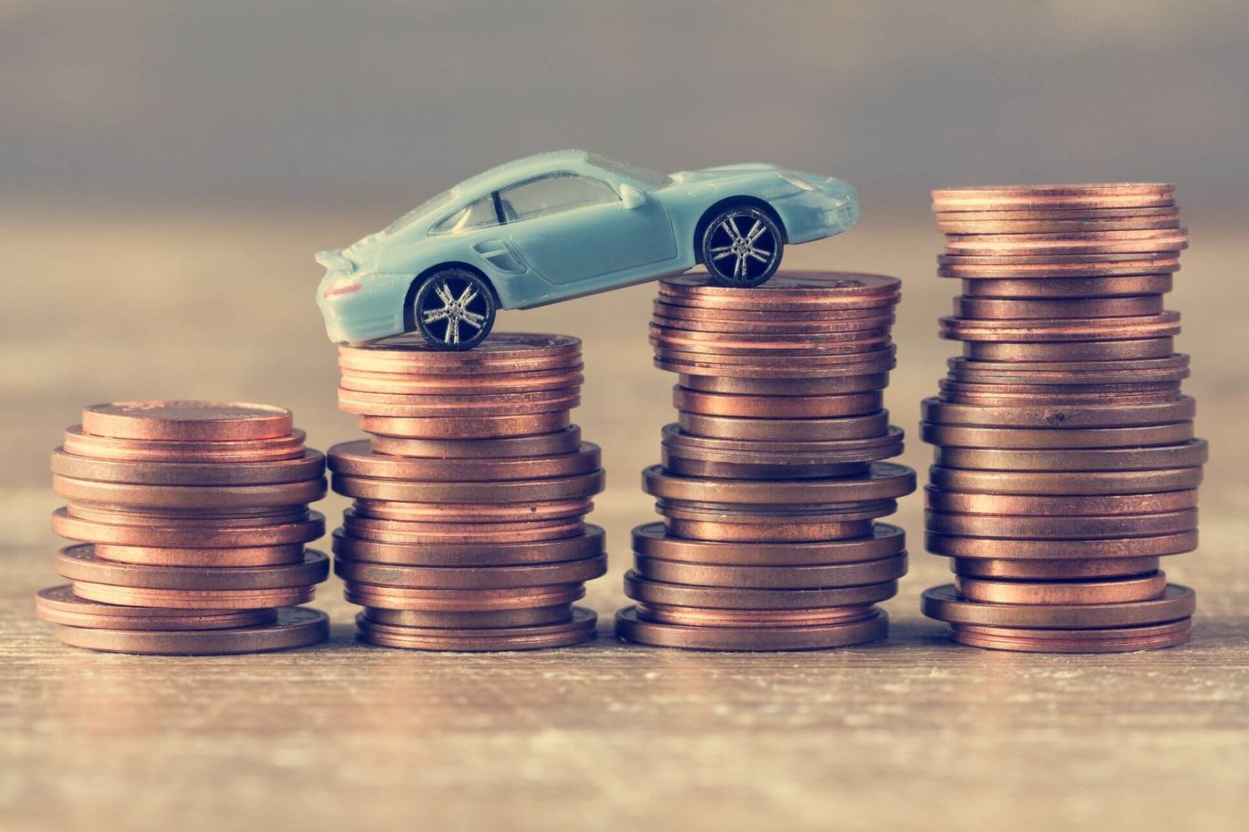 model of a car on coins