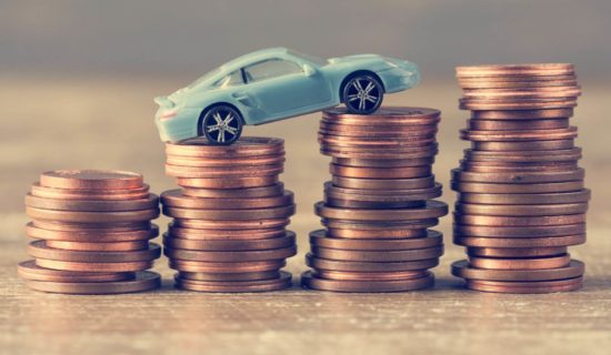 model of a car on coins