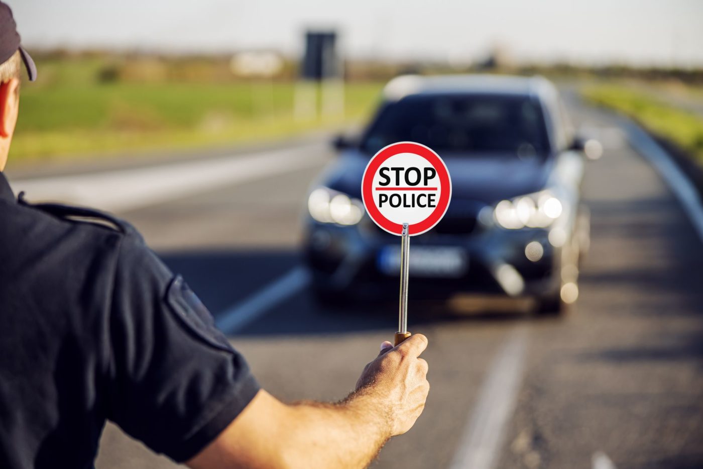 Policeman holding a stop sign