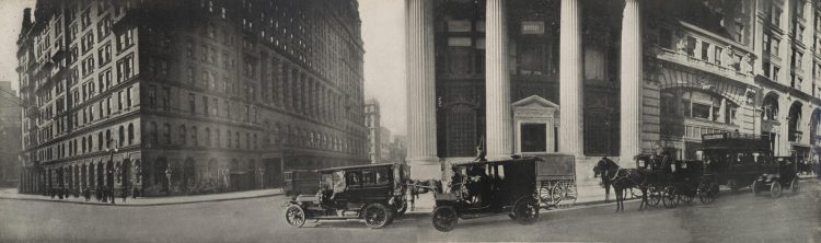 An old photograph of cars on the street