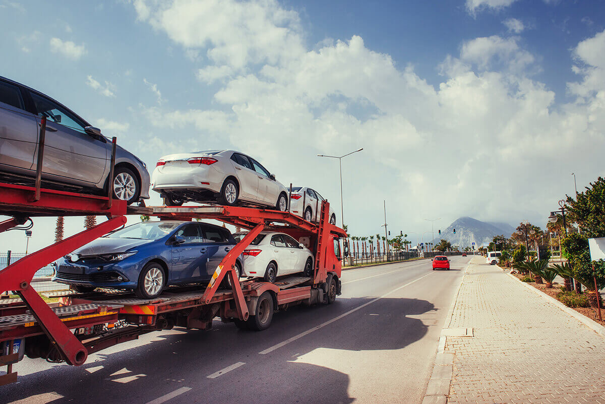 cars transferred on an open trailer