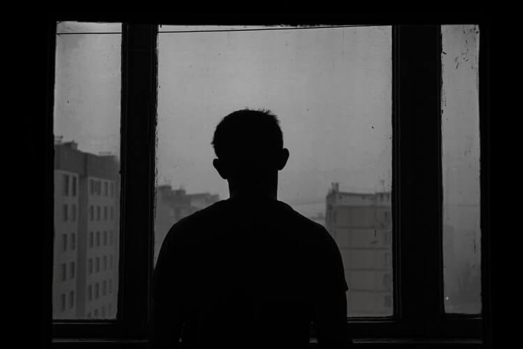 a man’s silhouette in black and white