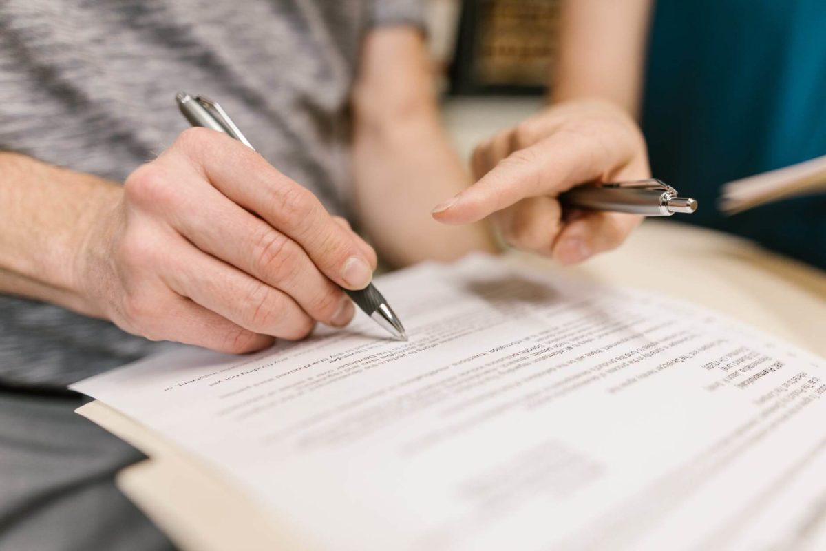 A man signing the lease contract
