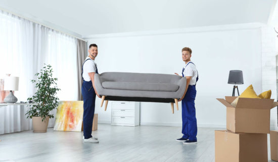 Movers carrying sofa