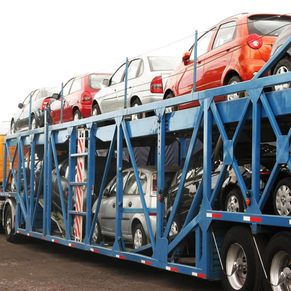 Auto transport company sipping cars on open trailer