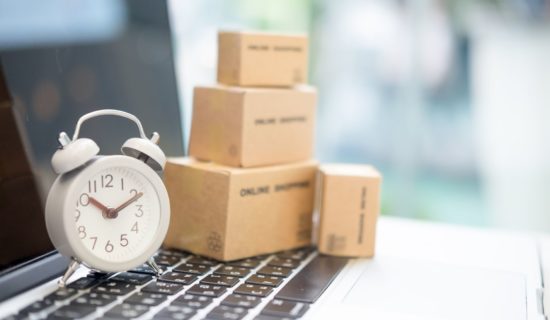 boxes, clock, and a laptop