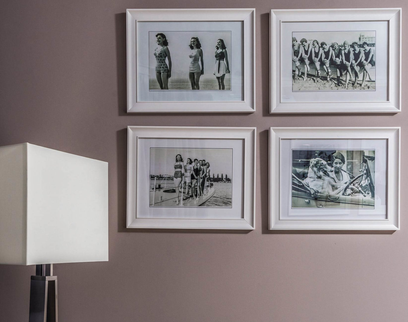 Four framed photographs on the wall