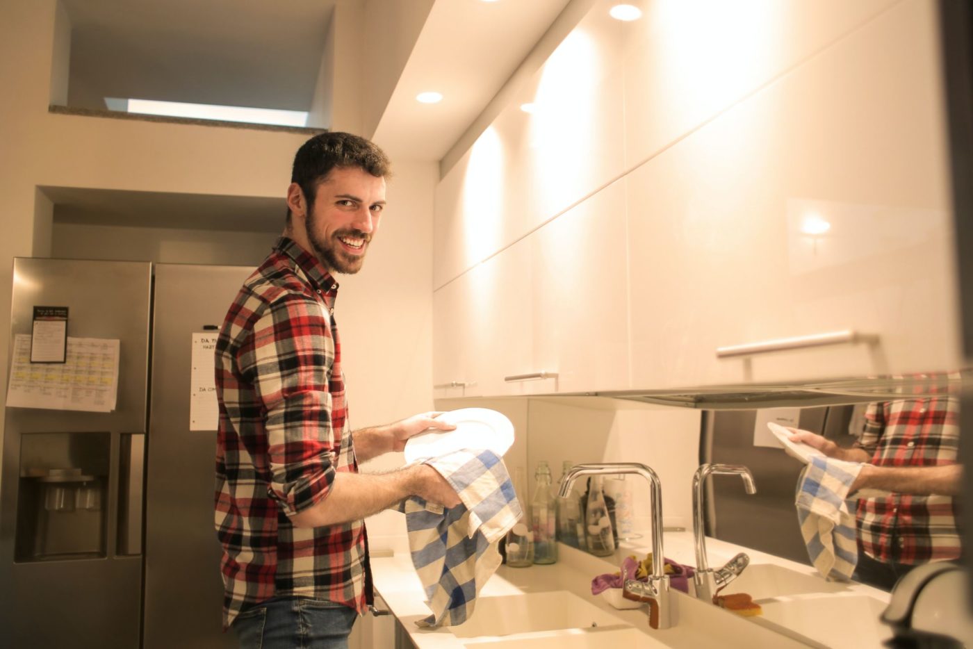 A man washing dishes