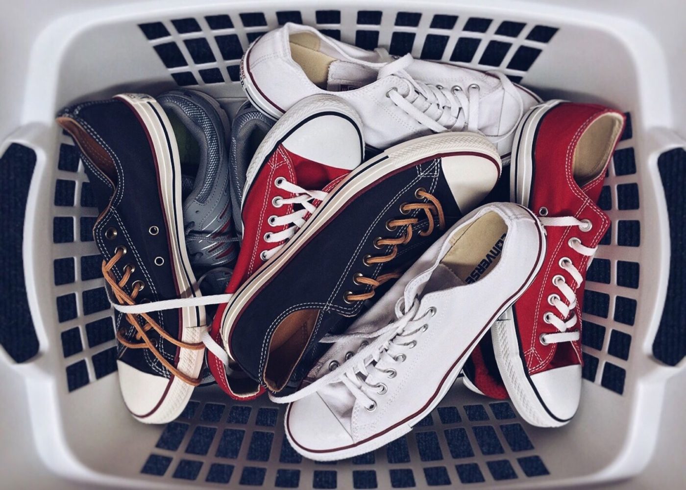 Shoes packed in the laundry basket before long-distance moving and auto transport