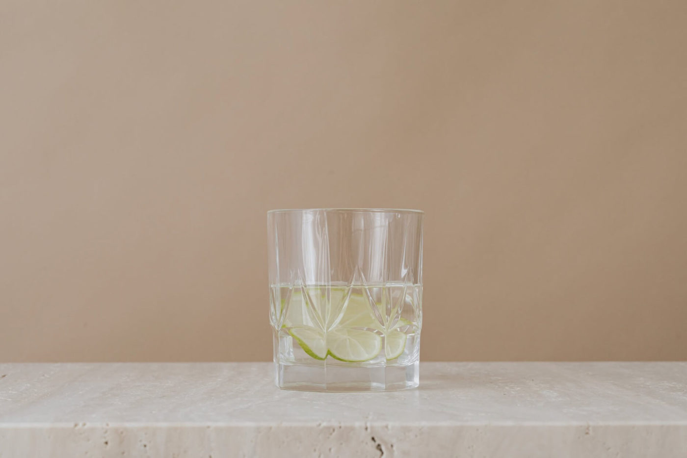 A glass with water and lime before the car shipping company comes to load the packages into the truck