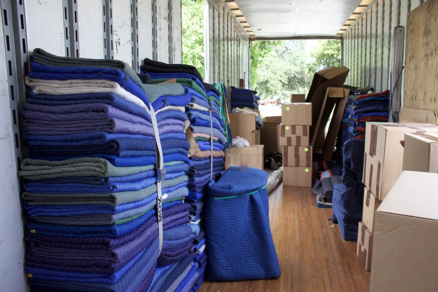 Stacked relocation blankets at an auto transport company