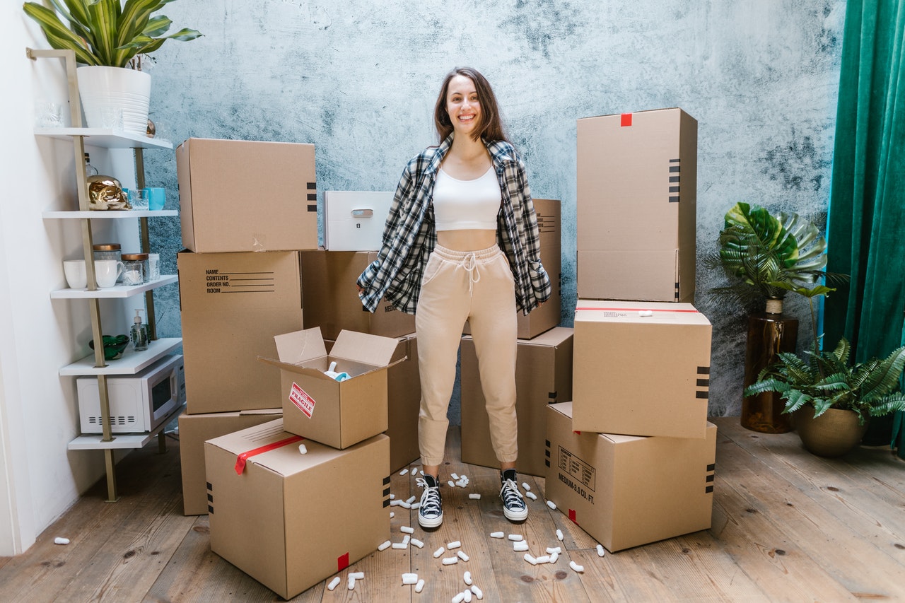 A young woman with a pile of packages