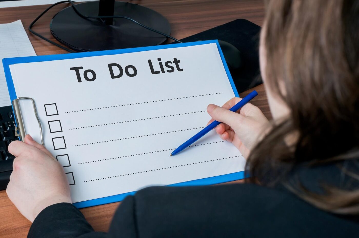 Woman writing a to-do list
