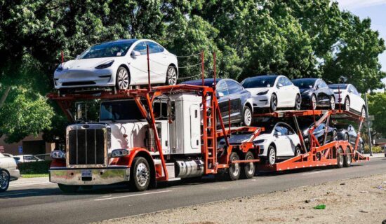 A USA auto transport truck filled with cars