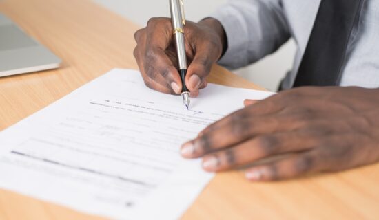A man signing papers