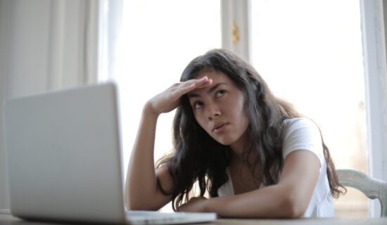 Angry woman sitting in front of a computer