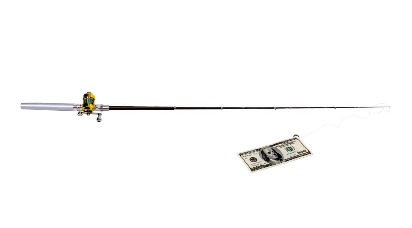 Fishing pole with rod and reel with large bills of money on the hook