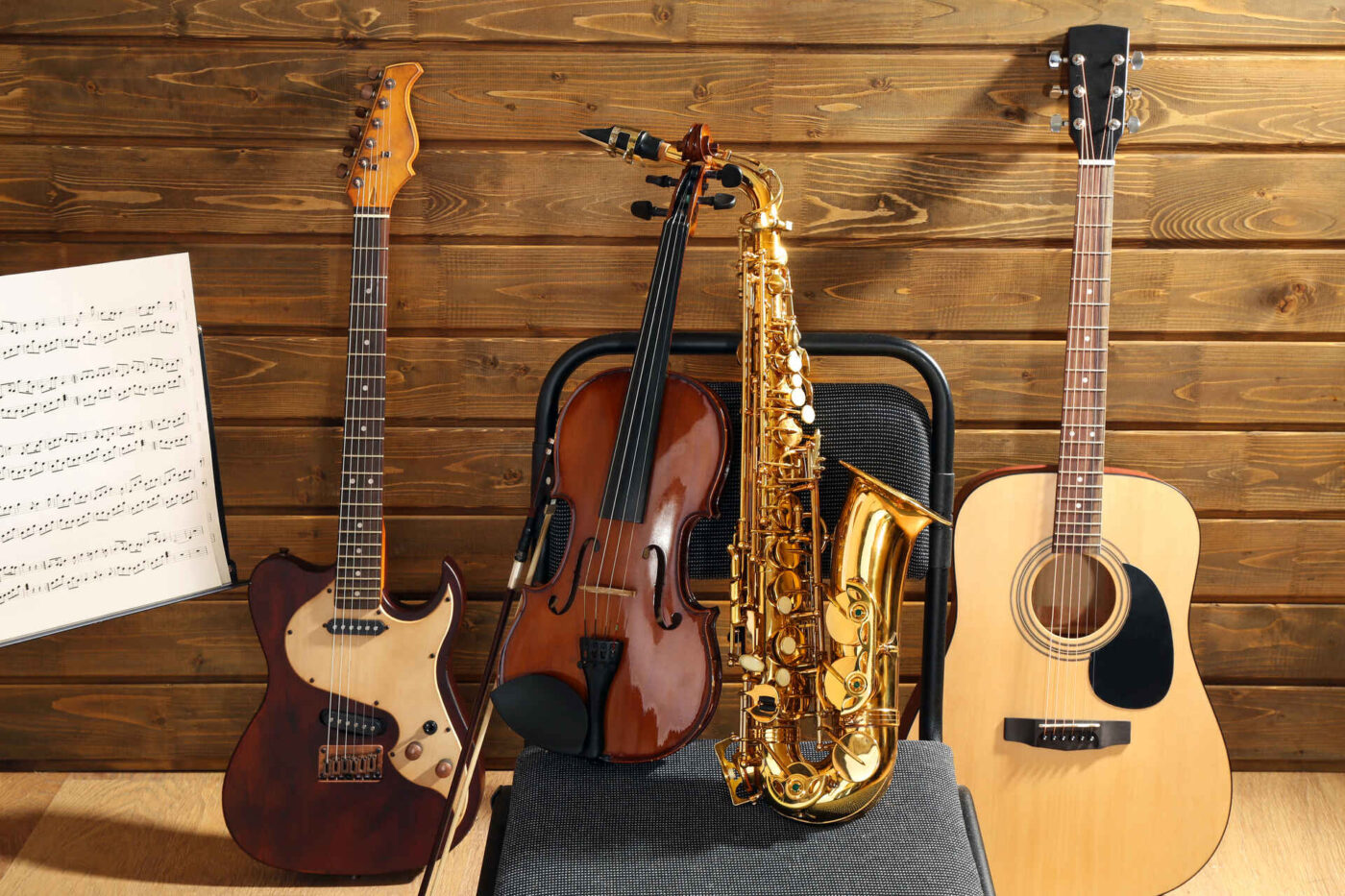 Different musical instruments against a wooden background