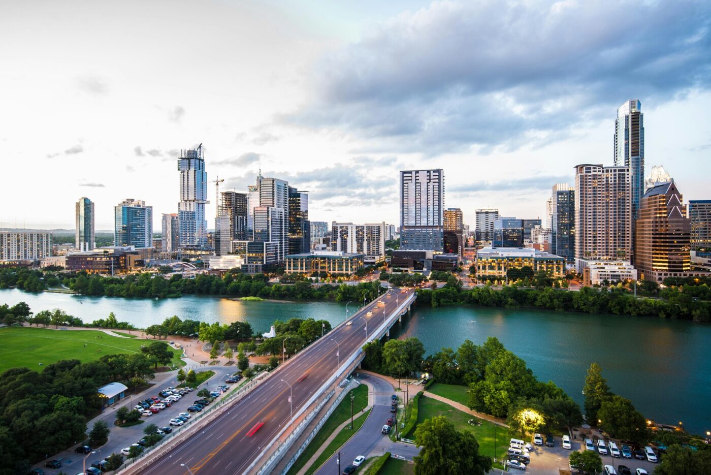Long exposure nighttime view of the Austin, Texas skyline and city traffic.